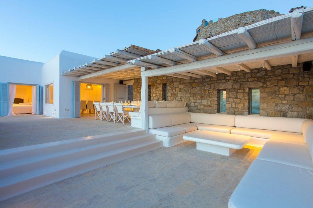 dimly lit terrace in white tone with stone walls