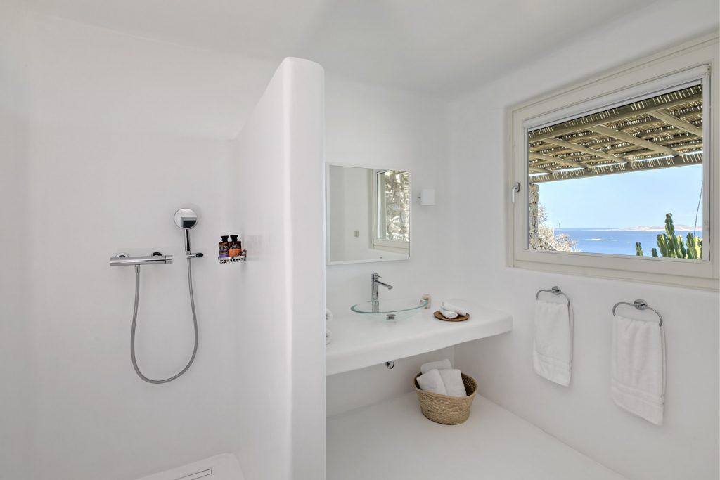 white wall bathroom with beautiful sea view