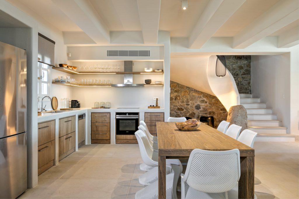 modern designed kitchen with wooden cabins and still oven