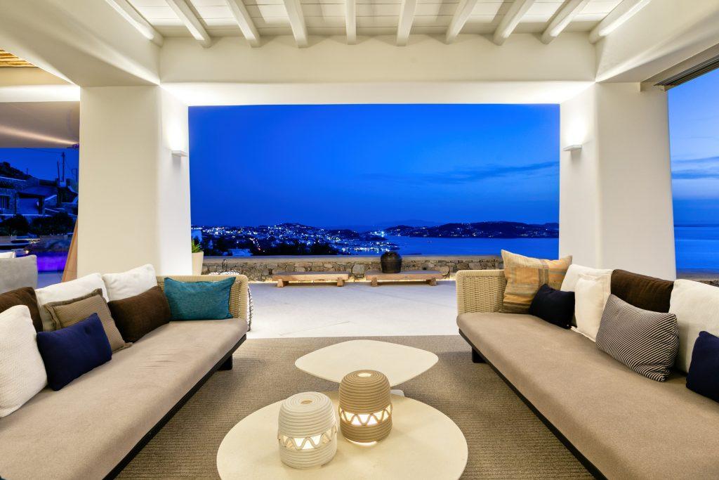 perfect night sea view with two cozy sofas on the porch