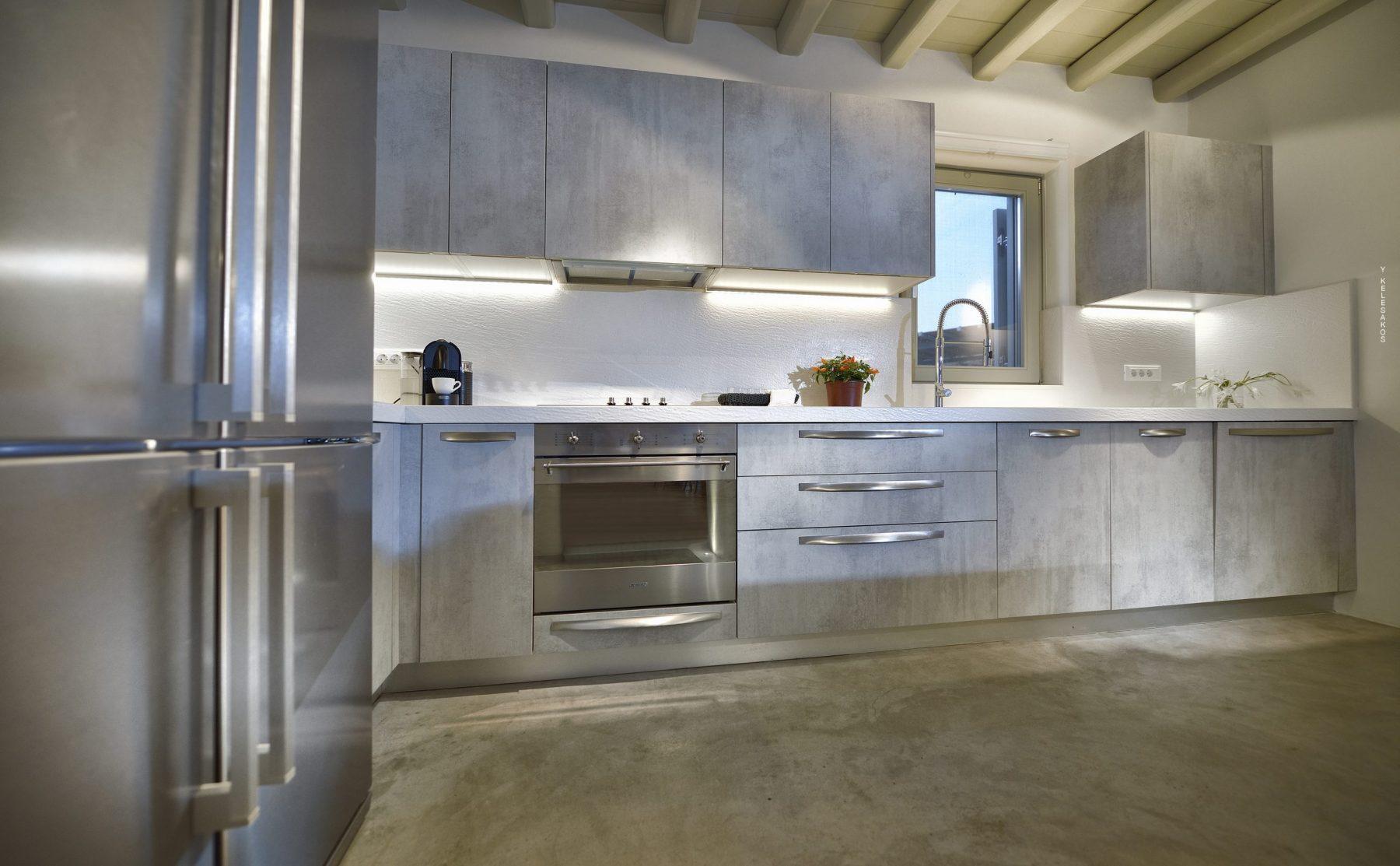 View of a gray, modern kitchen in Mykonos villa