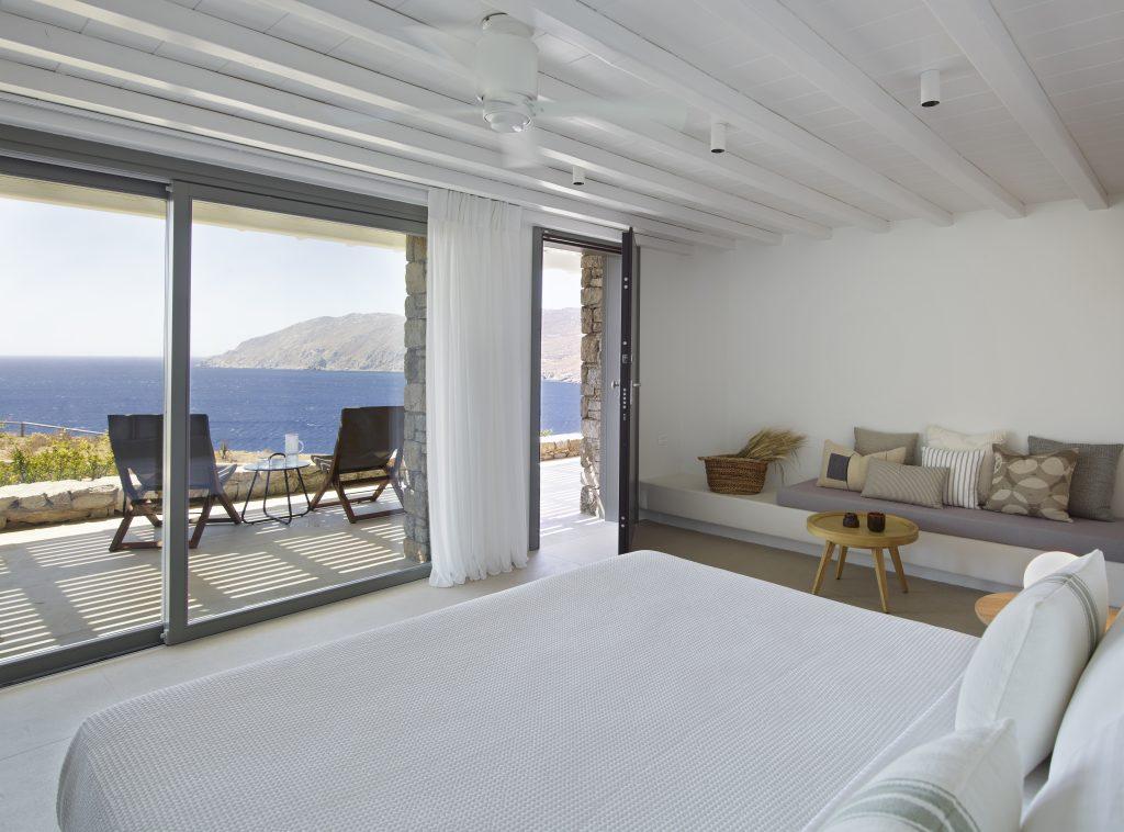 master bedroom with huge wall windows to fall asleep watching breathtaking sea panorama