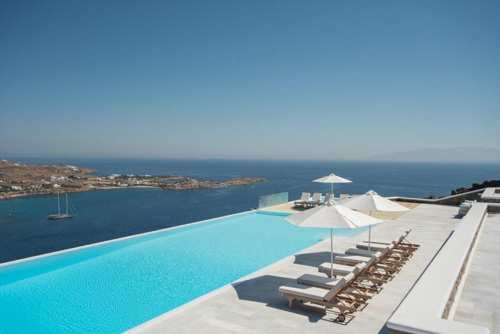 view of the beautiful blue sea and clear sky from the pool of pleasant water