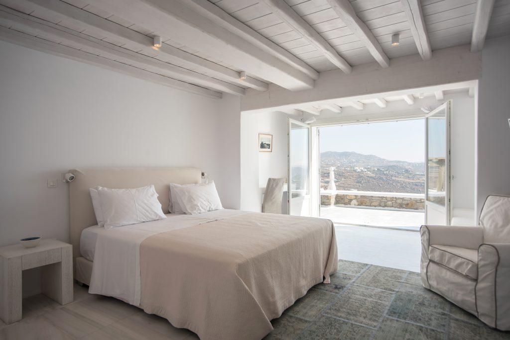 bedroom with a beautiful view and a comfortable bed