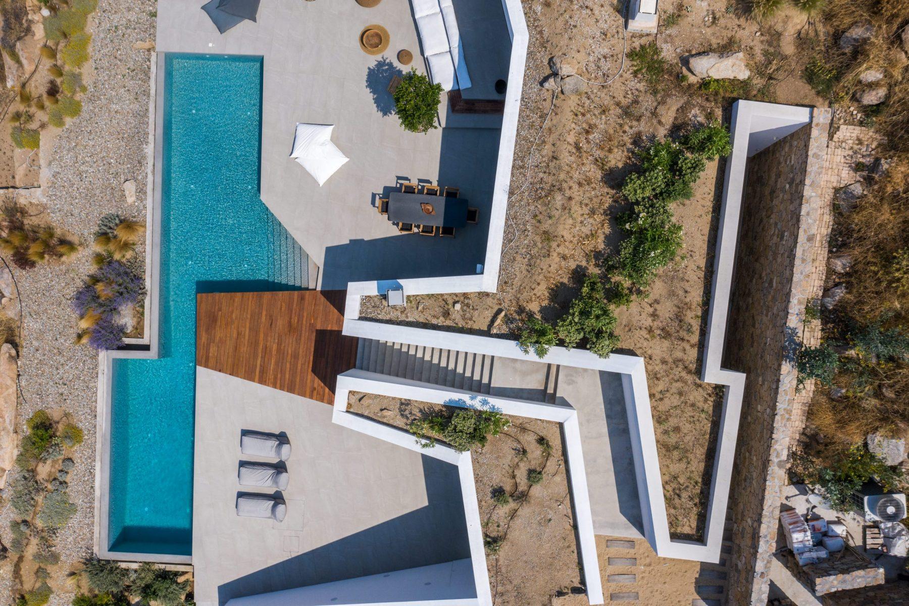 Aerial view of a luxurious villa with a pool