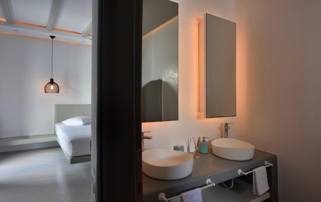 modernly designed bathroom in the bedroom with details of scented sticks that contribute to the atmosphere