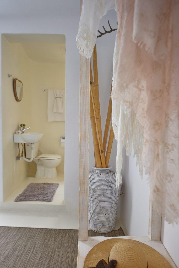 oom with a simply designed bathroom in white
