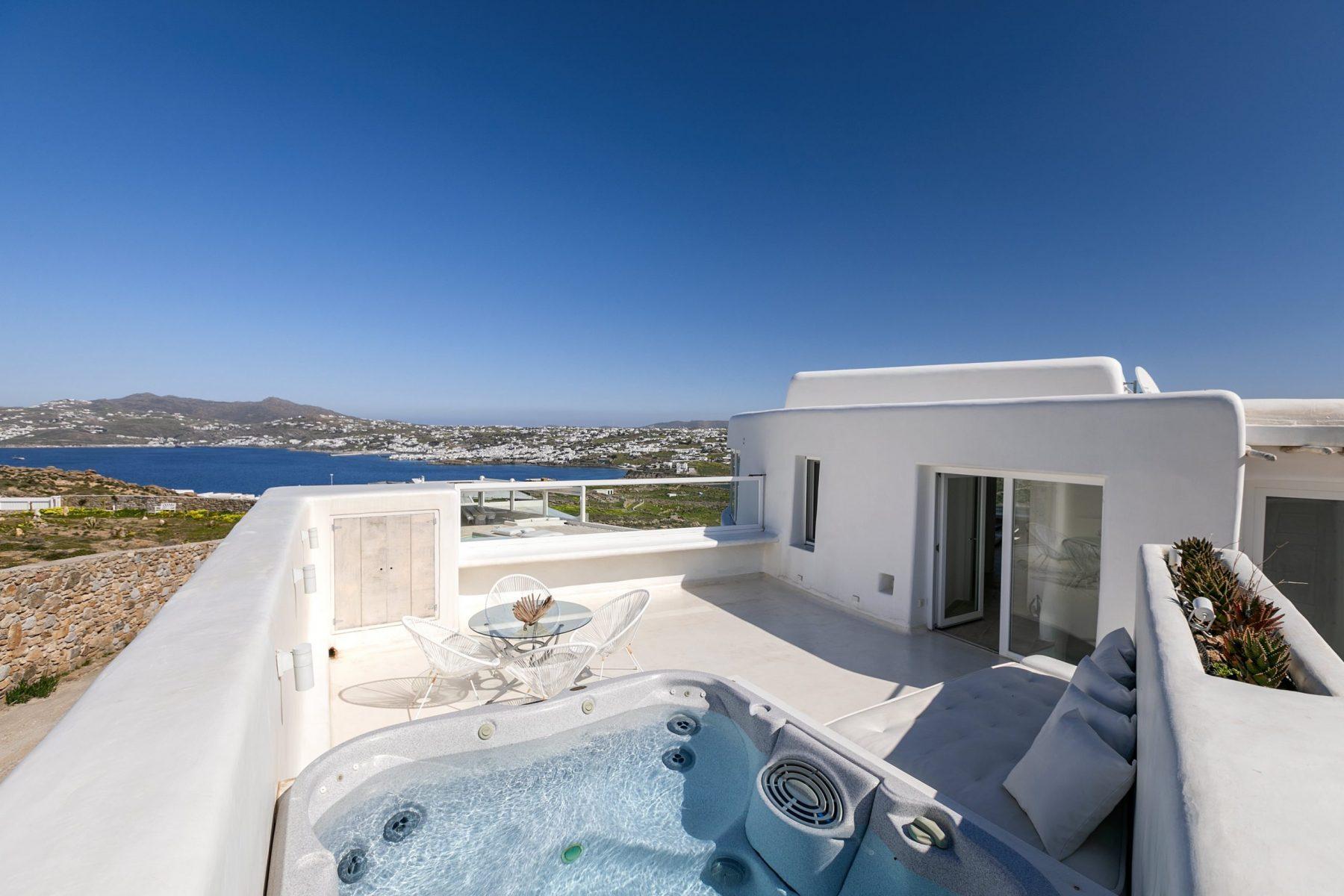 A balcony of a villa with a jacuzzi