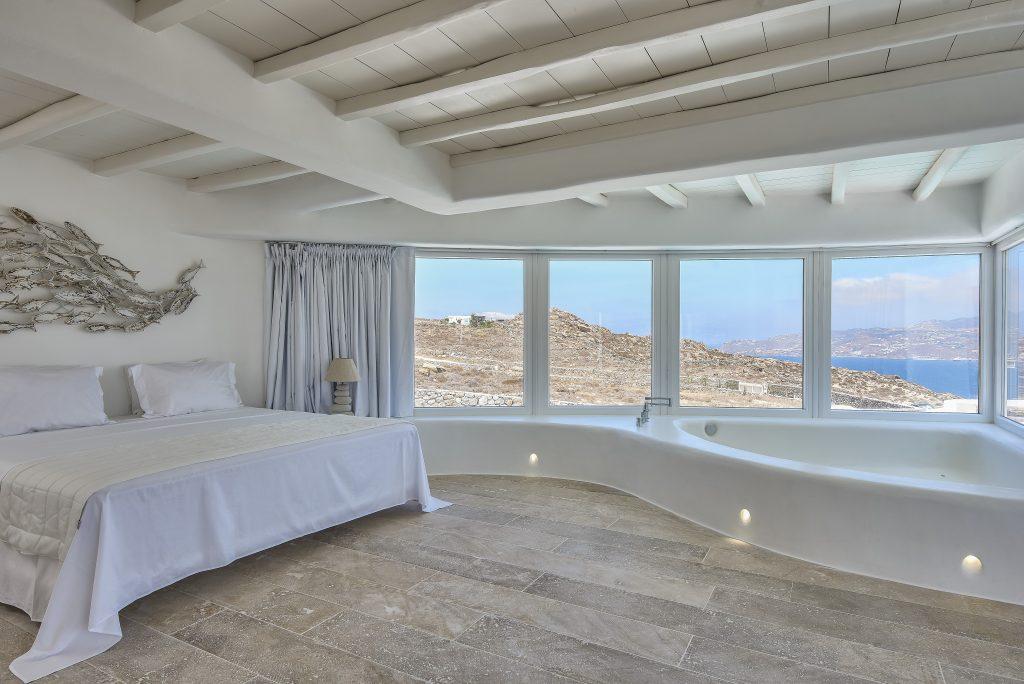 room with sea views and large windows that provide daylight
