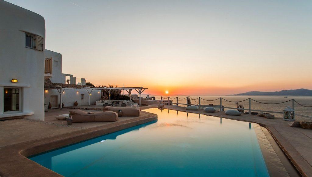 view of the villa with an enchanting view of the sunset over the blue calm sea
